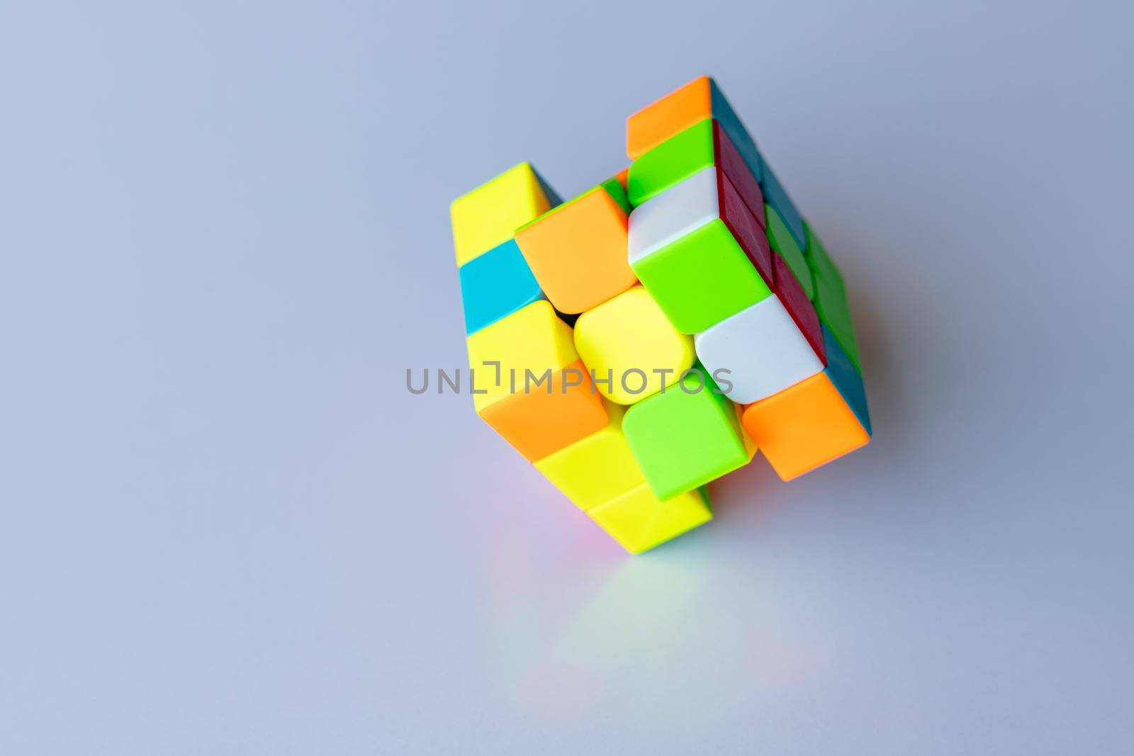 Magic cube or puzzle cube on a white isolated background by Bilalphotos