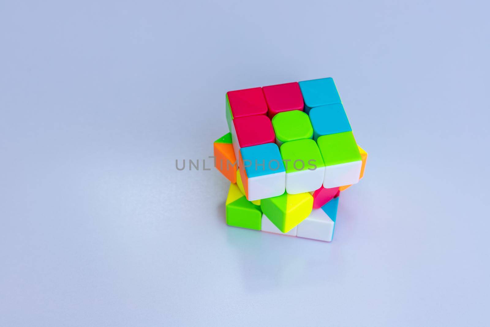 3x3 Rubik's cube on a white isolated background with selective focus