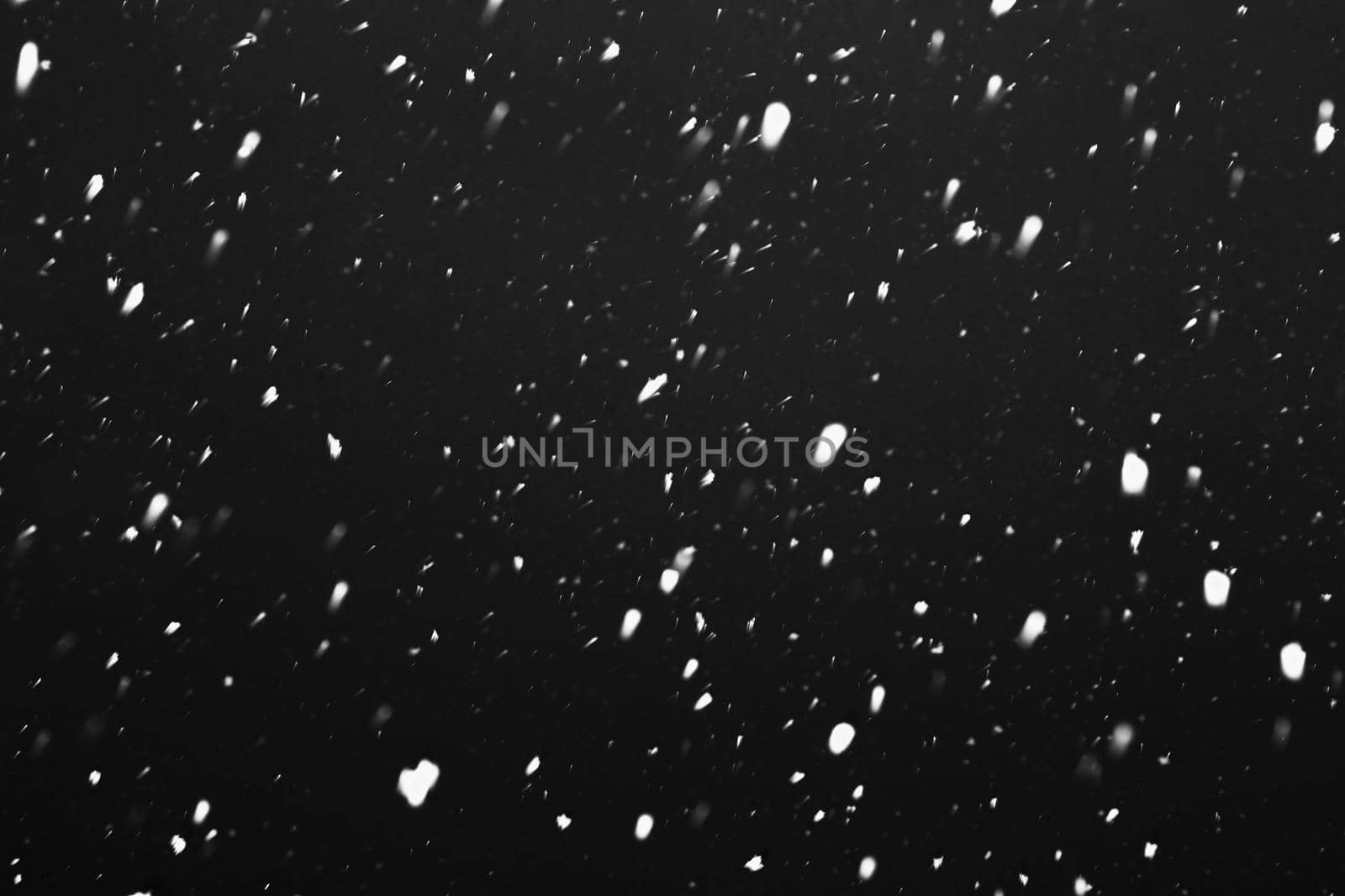 Heavy snowfall. Snow is falling against the sky. Snowflakes are flying. Winter, snowfall.