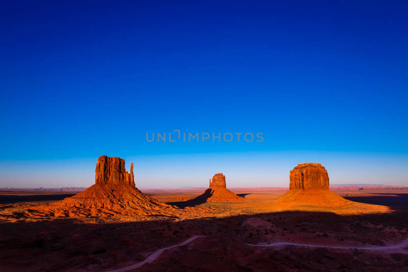 The Mittens, three buttes in Monument Valley at sunrise, Arizona and Utah, United States