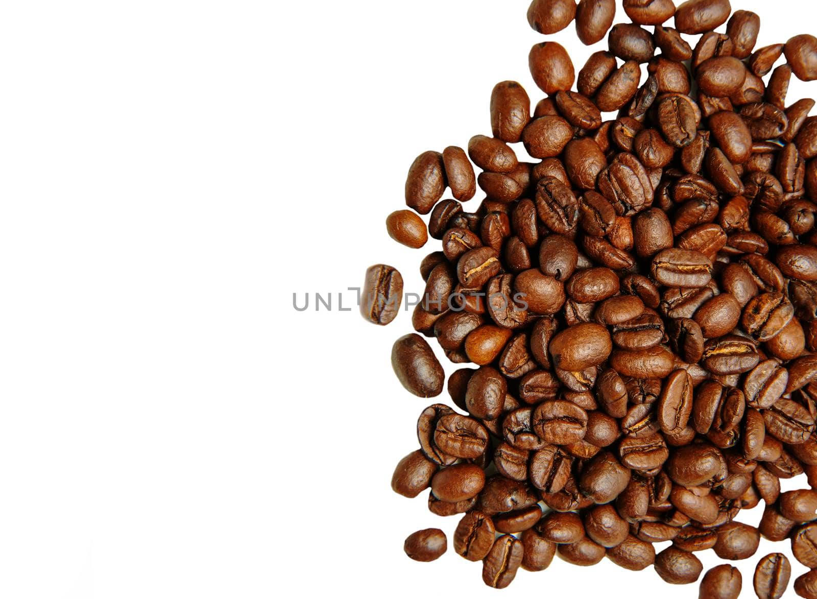 coffee beans close-up. roasted coffee beans on a white background. copy space
