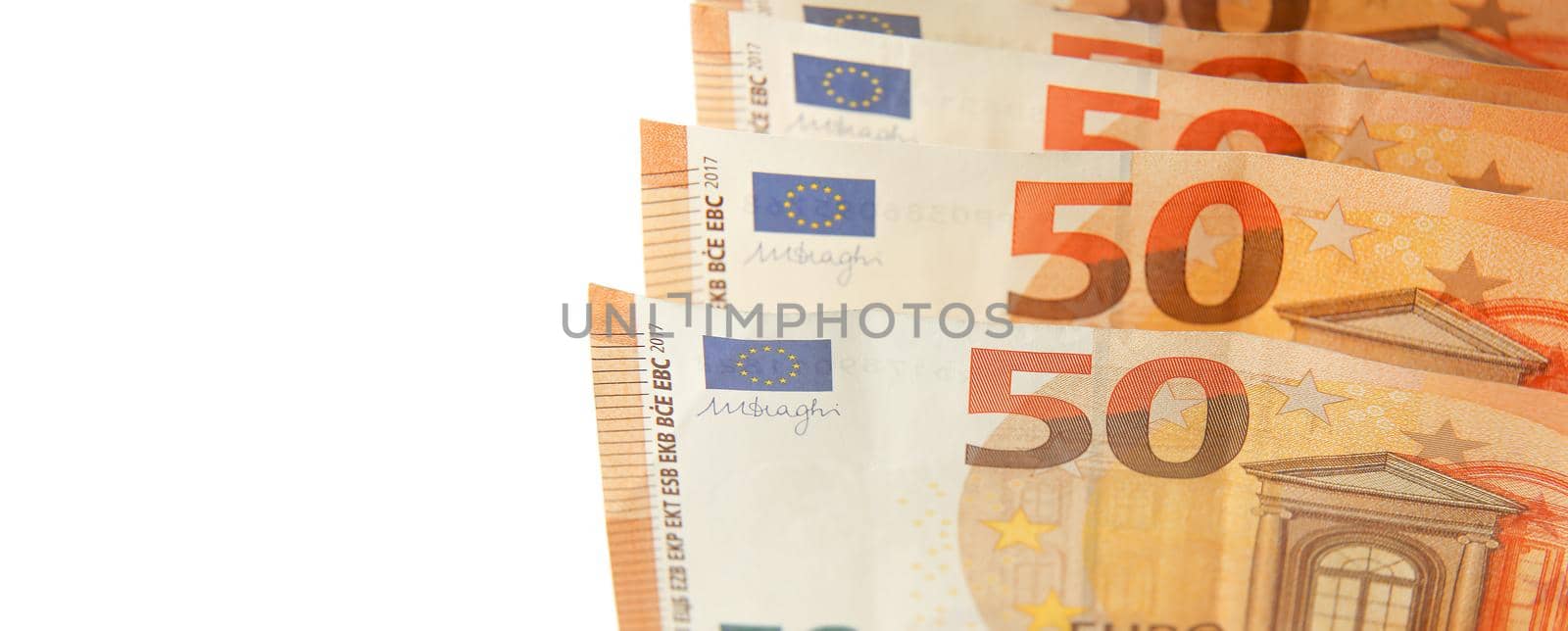 Banknotes 50 euro banknotes close-up with a white background on the left. Paper cash Euro banknotes.