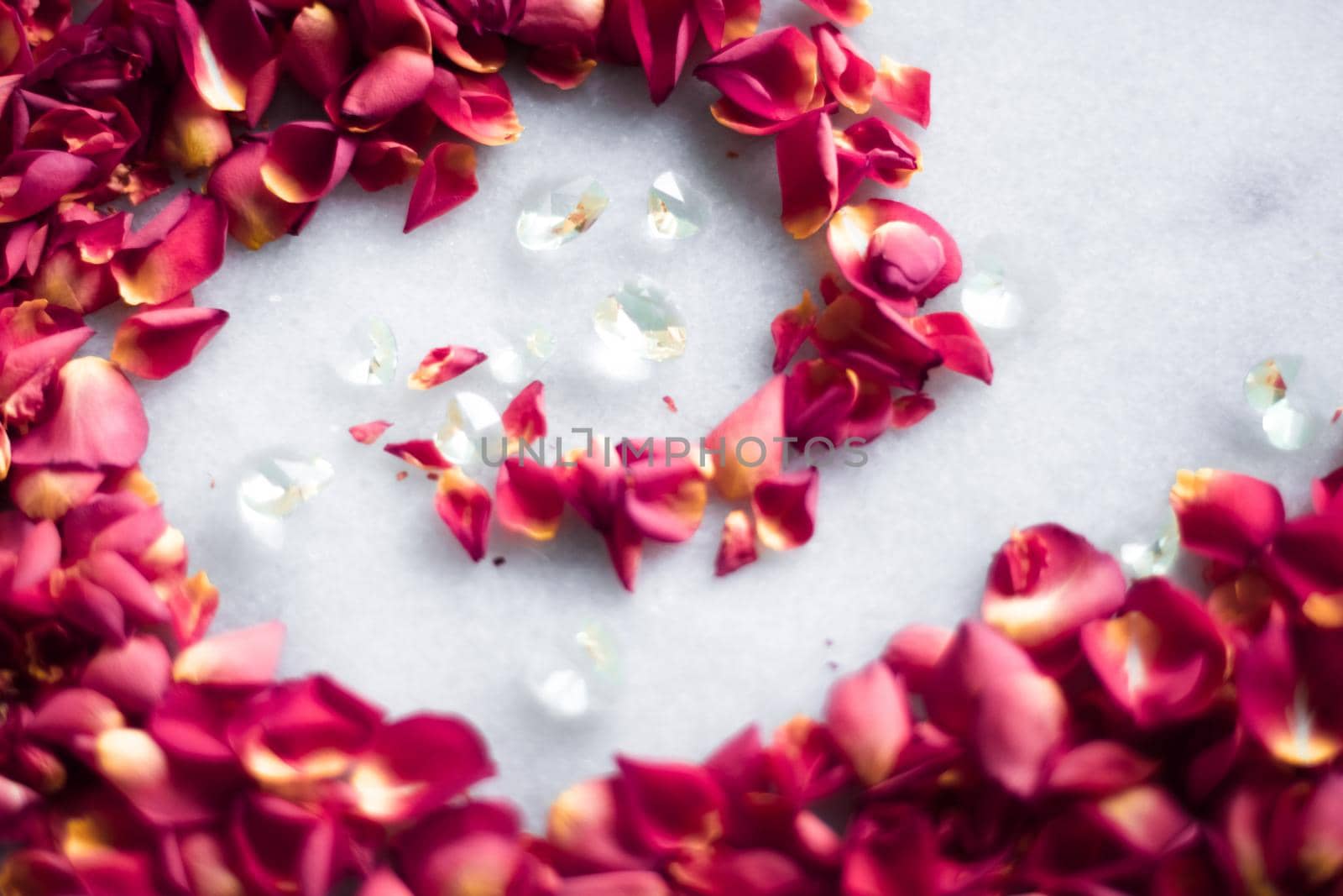 rose petals on marble flatlay - wedding, holiday and floral background styled concept, elegant visuals