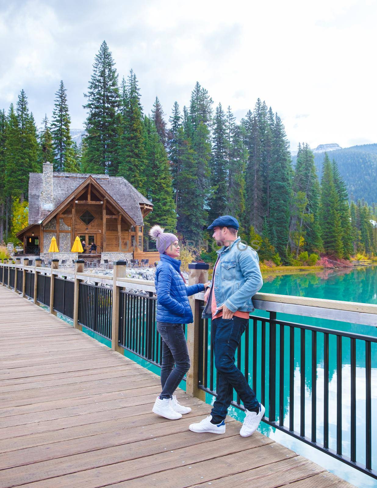 Emerald lake Yoho national park Canada British Colombia. beautiful lake in the Canadian Rockies during the Autumn fall season. Couple of men and women standing by the lake