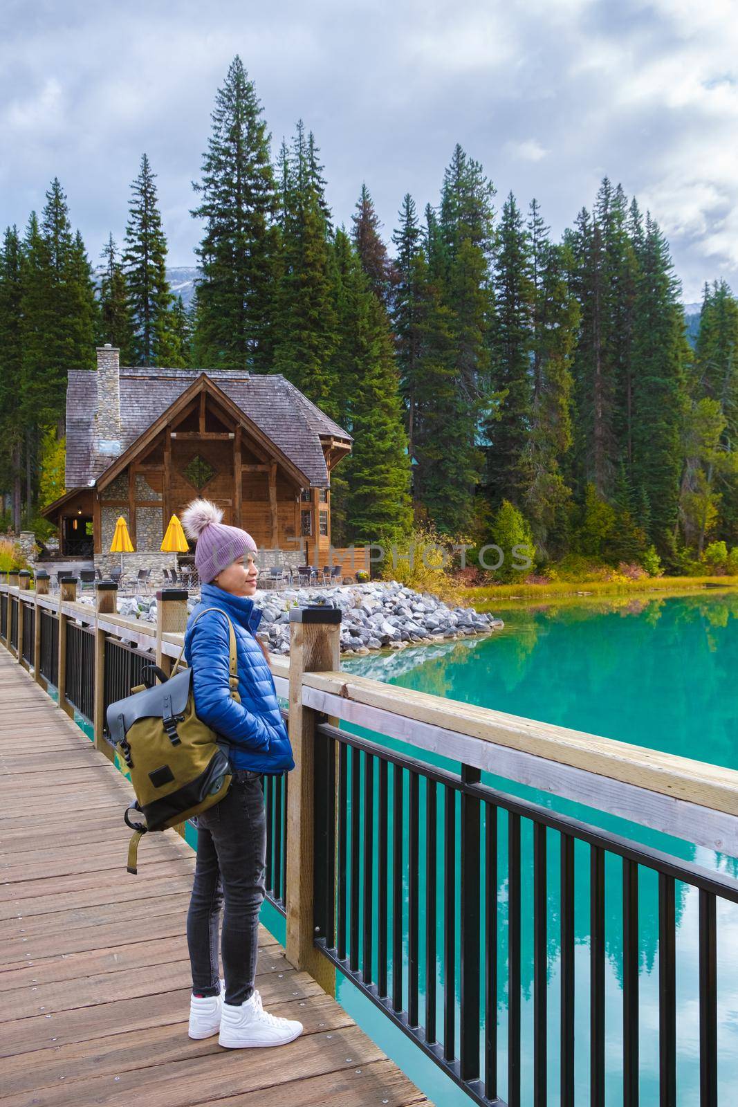 Emerald lake Yoho national park Canada British Colombia. beautiful lake in the Canadian Rockies during the Autumn fall season. Couple of men and women standing by the lake