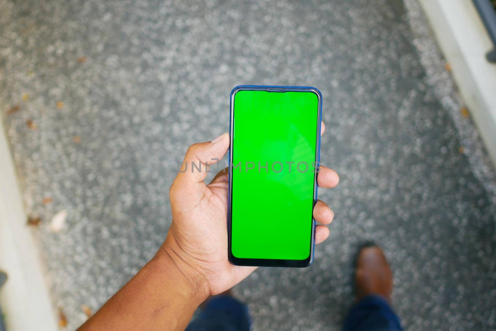 Close up of young man hand using smart phone