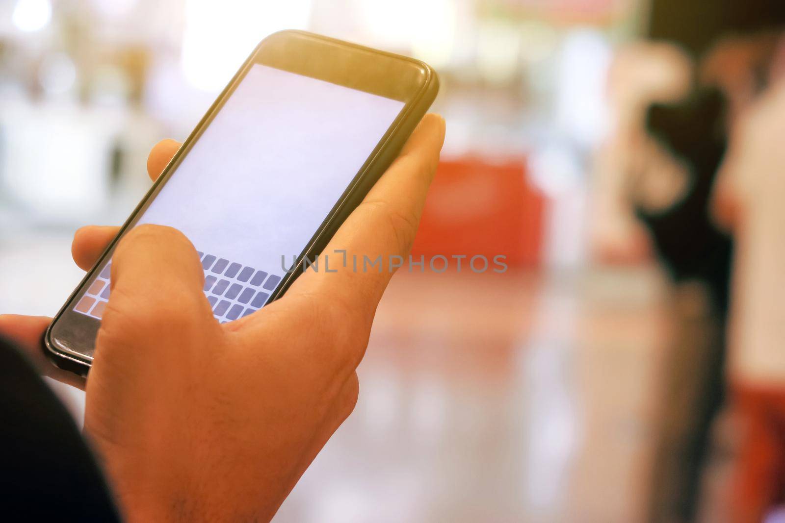 Closeup Image of man checking his phone