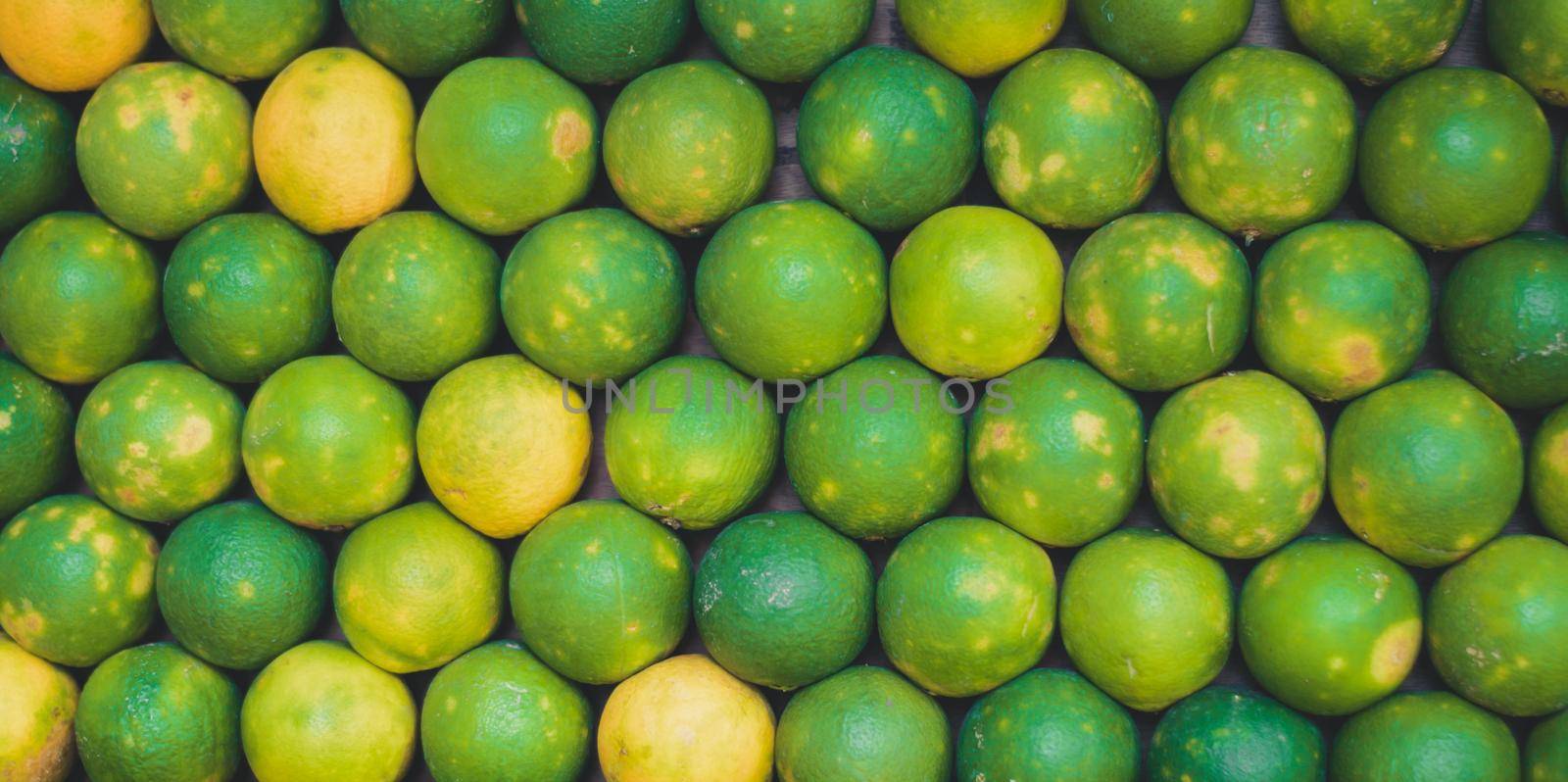 Full Frame Photo Of Fresh Green Mausami, sweet lemon For Sale In The Market, Fruit backgrounds by sudiptabhowmick