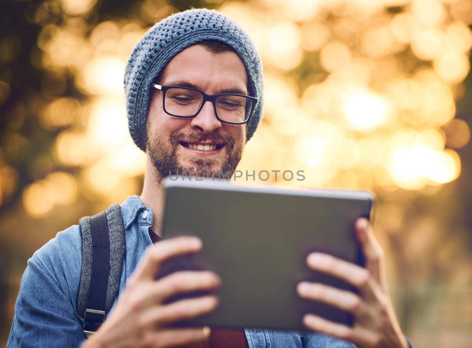 Technology and the outdoors can go together. a handsome young man using a tablet outdoors