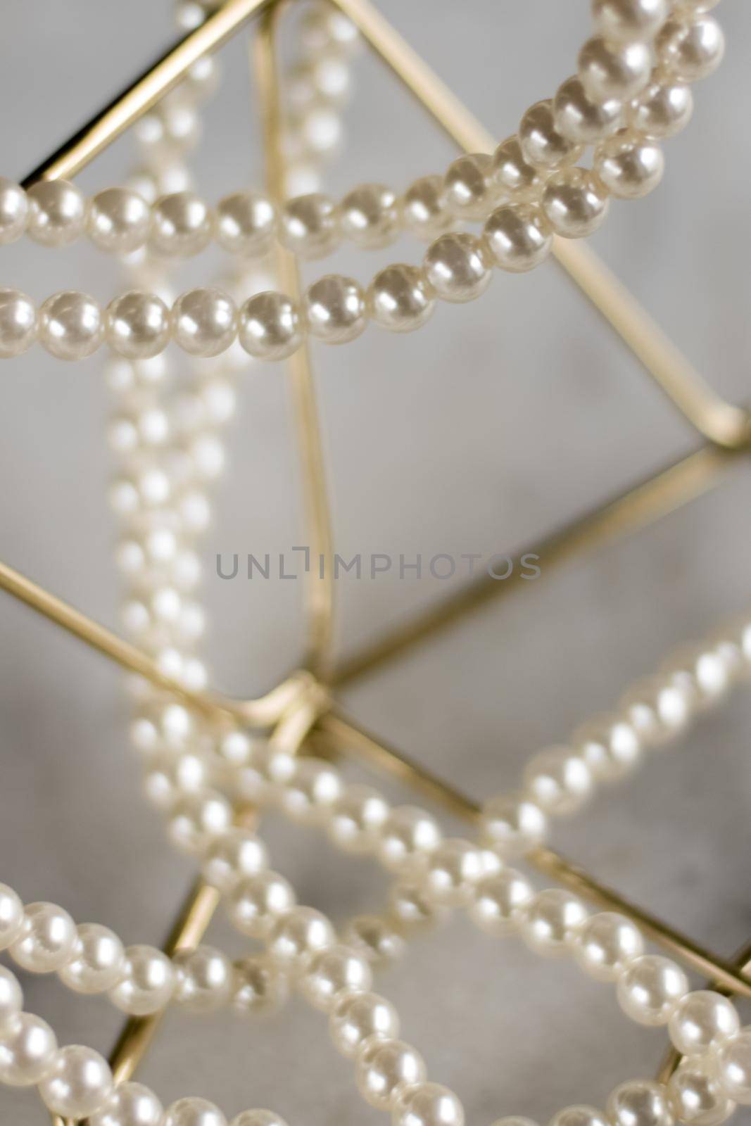 Pearl necklace on golden marble, ethical jewellery - luxury background, jewelry as a gift concept. Pearls are girl's best friends