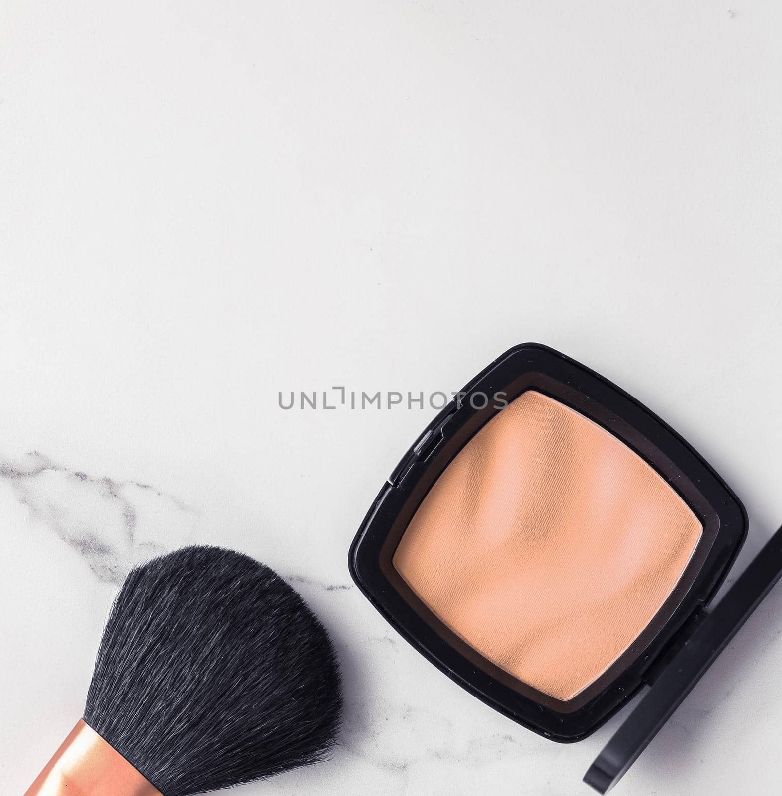 Make-up and cosmetics flatlay on marble by Anneleven