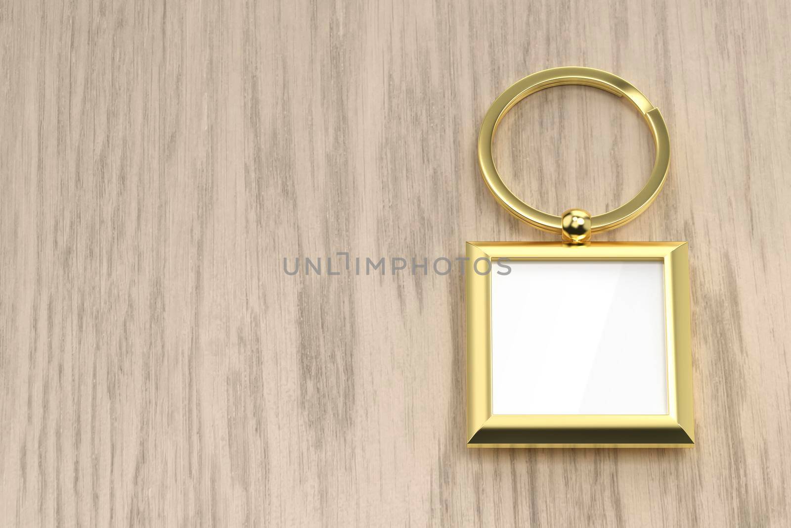 Square golden keychain on the wooden table