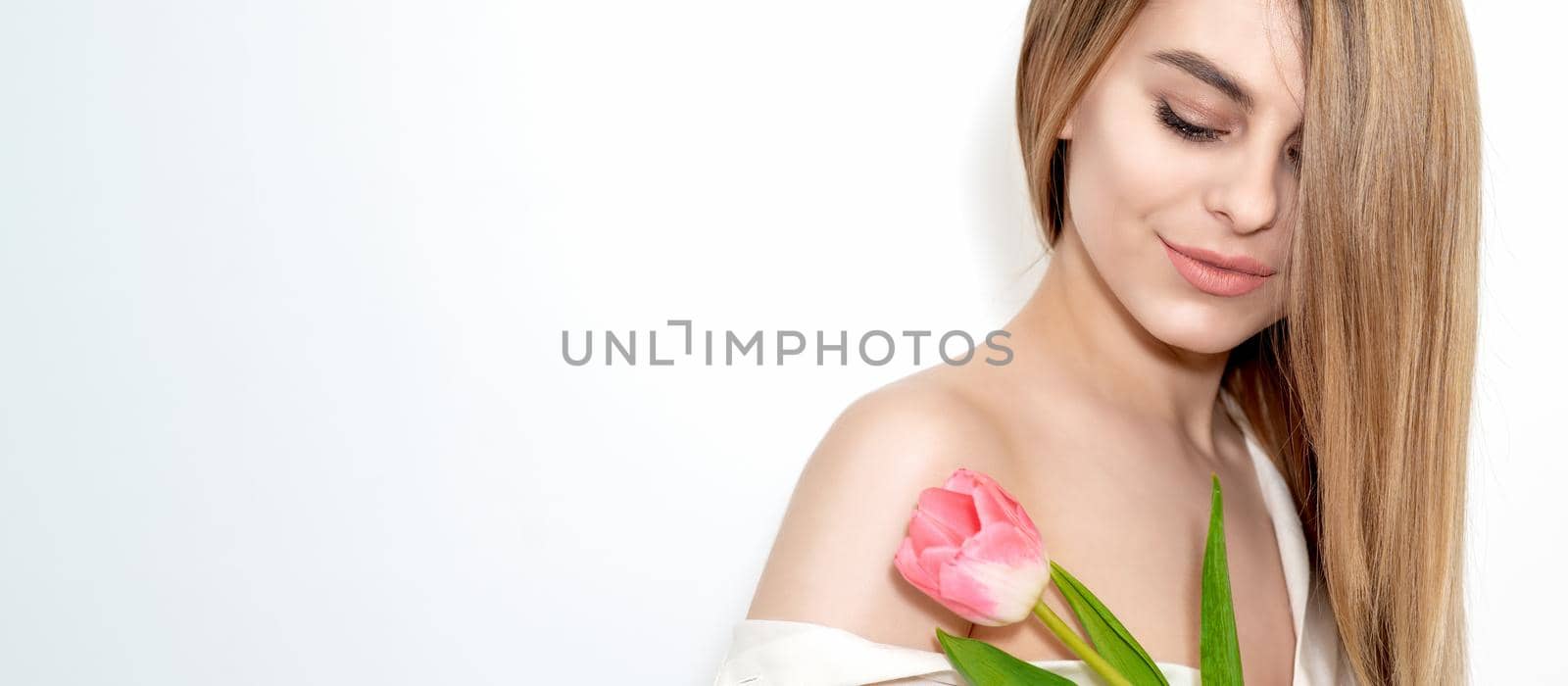 Woman with one pink tulip by okskukuruza