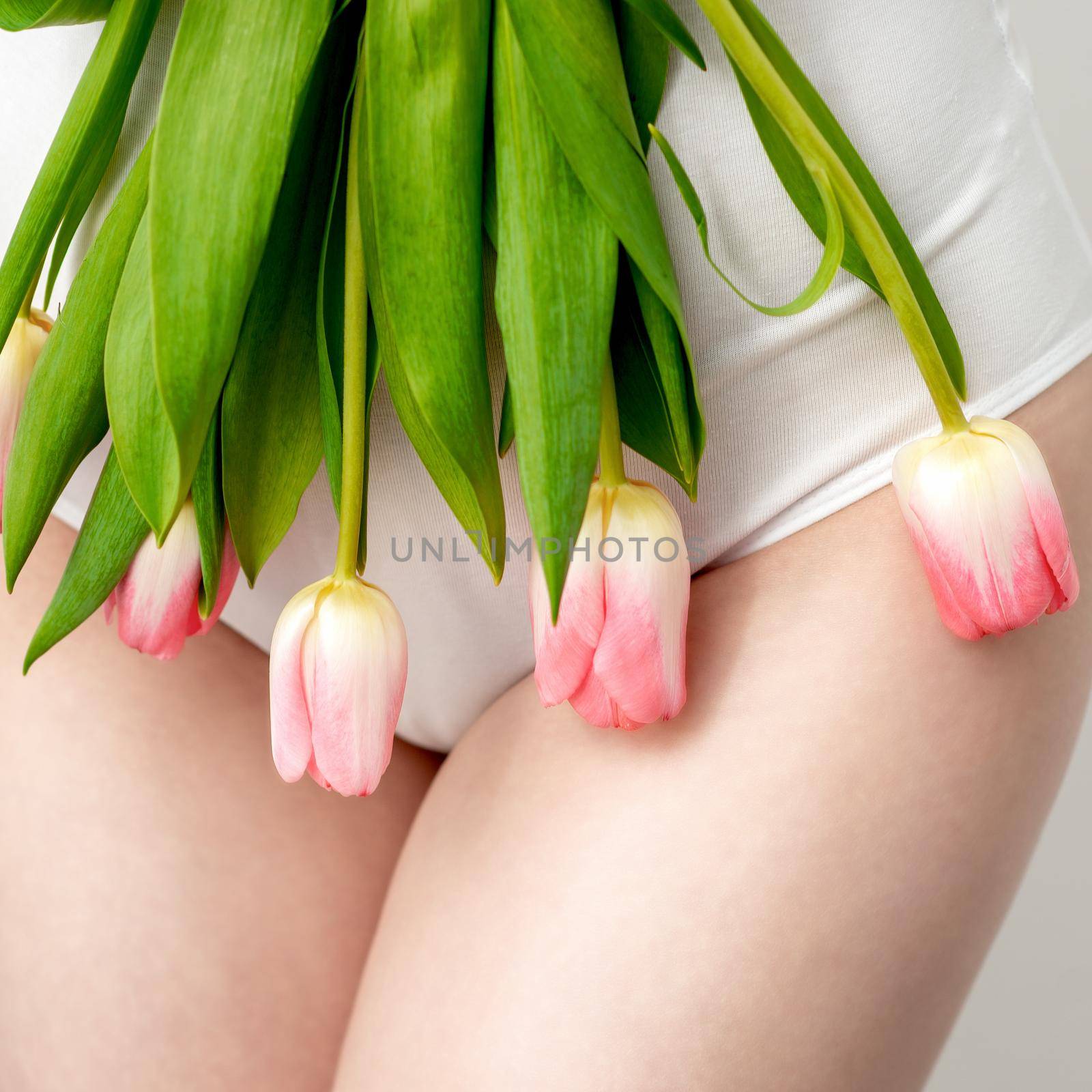 Woman's bikini area with tulips by okskukuruza