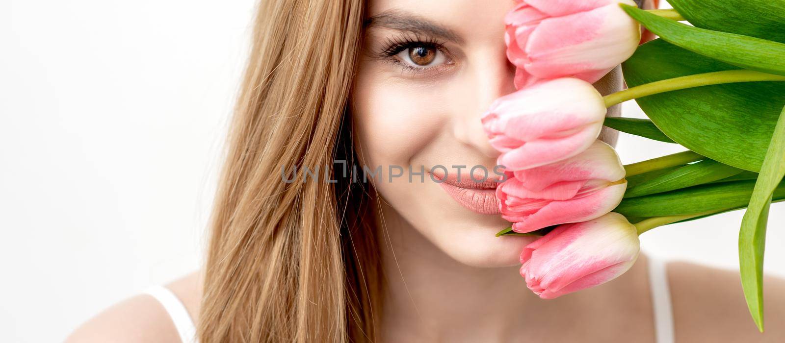 Portrait of woman with pink tulips by okskukuruza