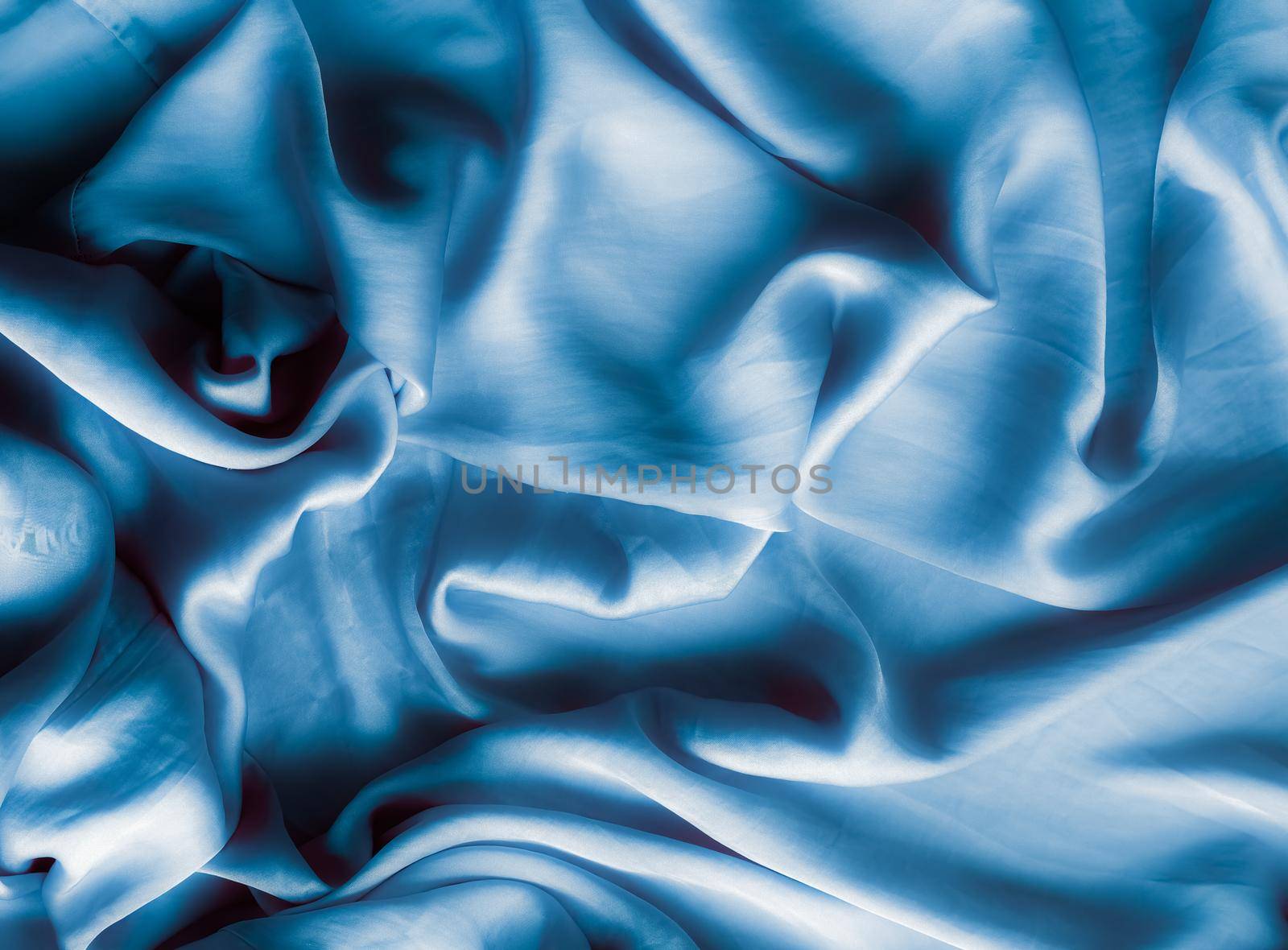 Blue soft silk waves, flatlay - elegant fabric textures, abstract backgrounds and modern pastel colours concept. Feel the touch of luxury