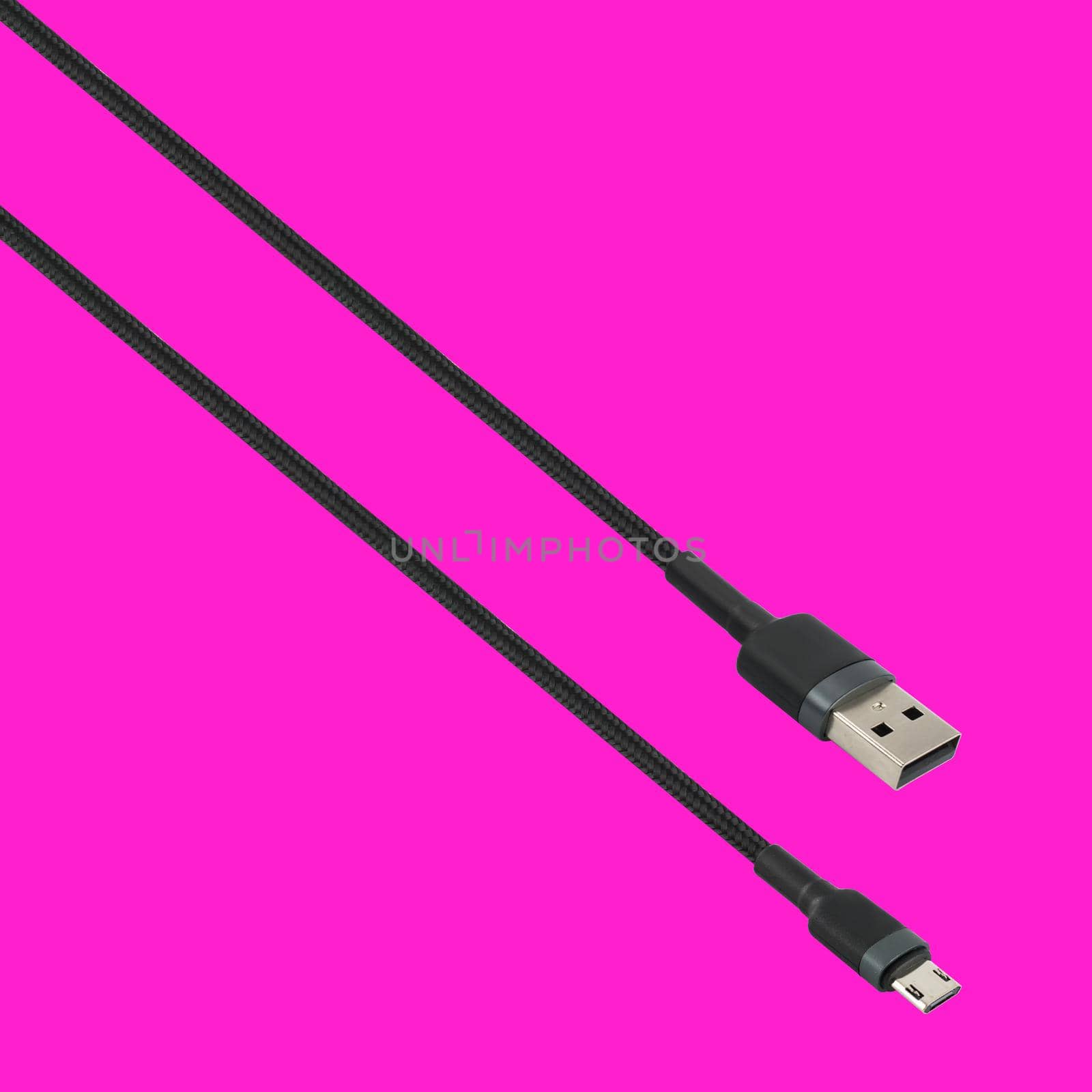 Cable with USB and micro USB connector, isolated on a red background