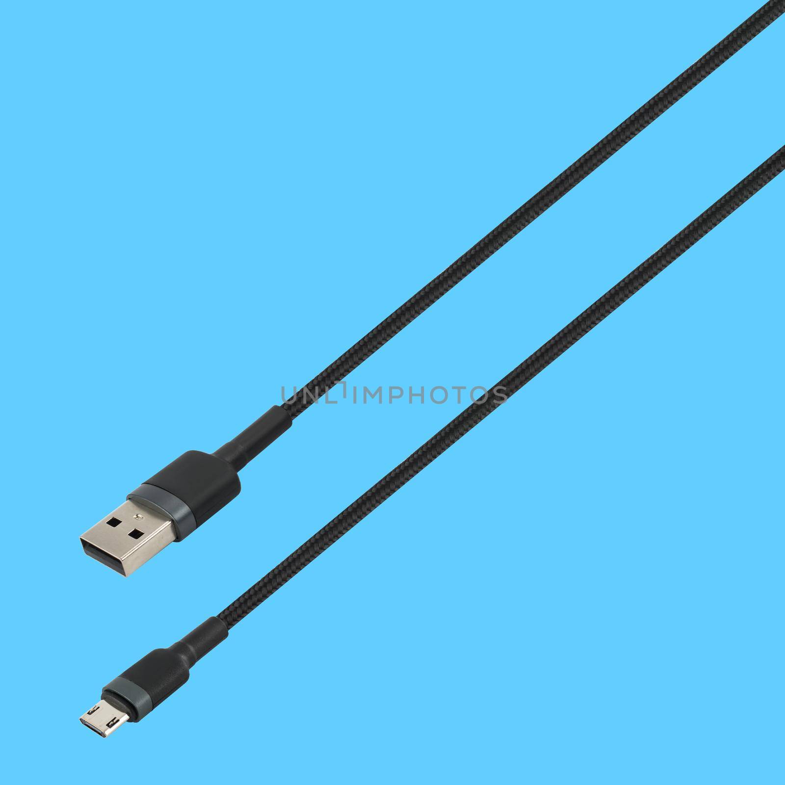 Cable with USB and micro USB connector, on a blue background