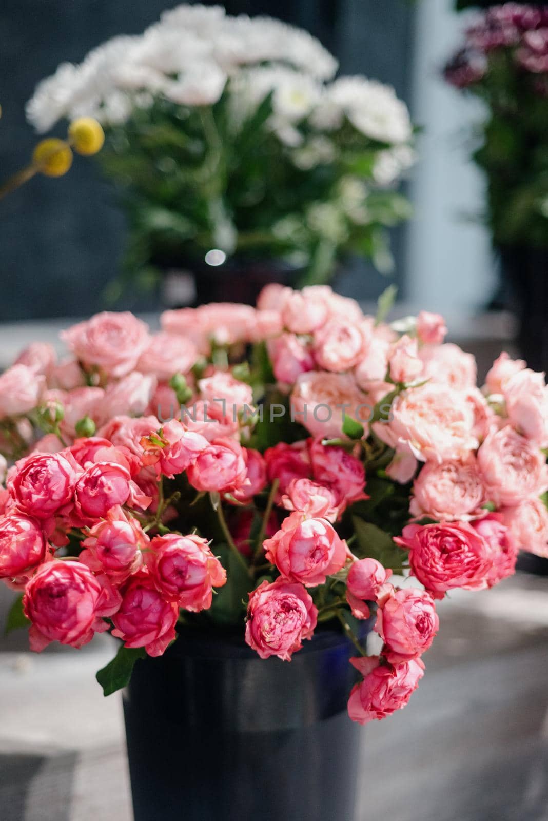 Pink roses in a flower shop.Beautiful flowers for a catalog, online store. Flower business. Concept flower store and delivery.