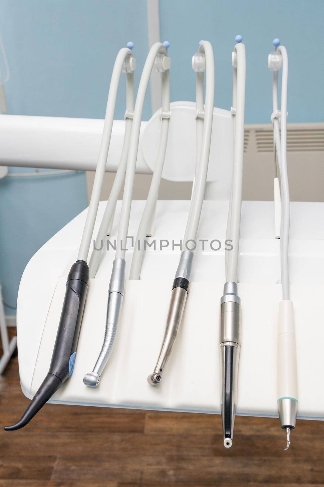 in the dental office, a mobile table with drills and other dental instruments that are part of the dental unit. treatment with disinfecting materials was carried out