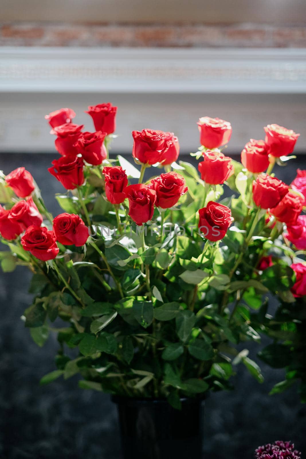 Red roses in a flower shop.Beautiful flowers for a catalog, online store. Flower business. Concept flower store and delivery.