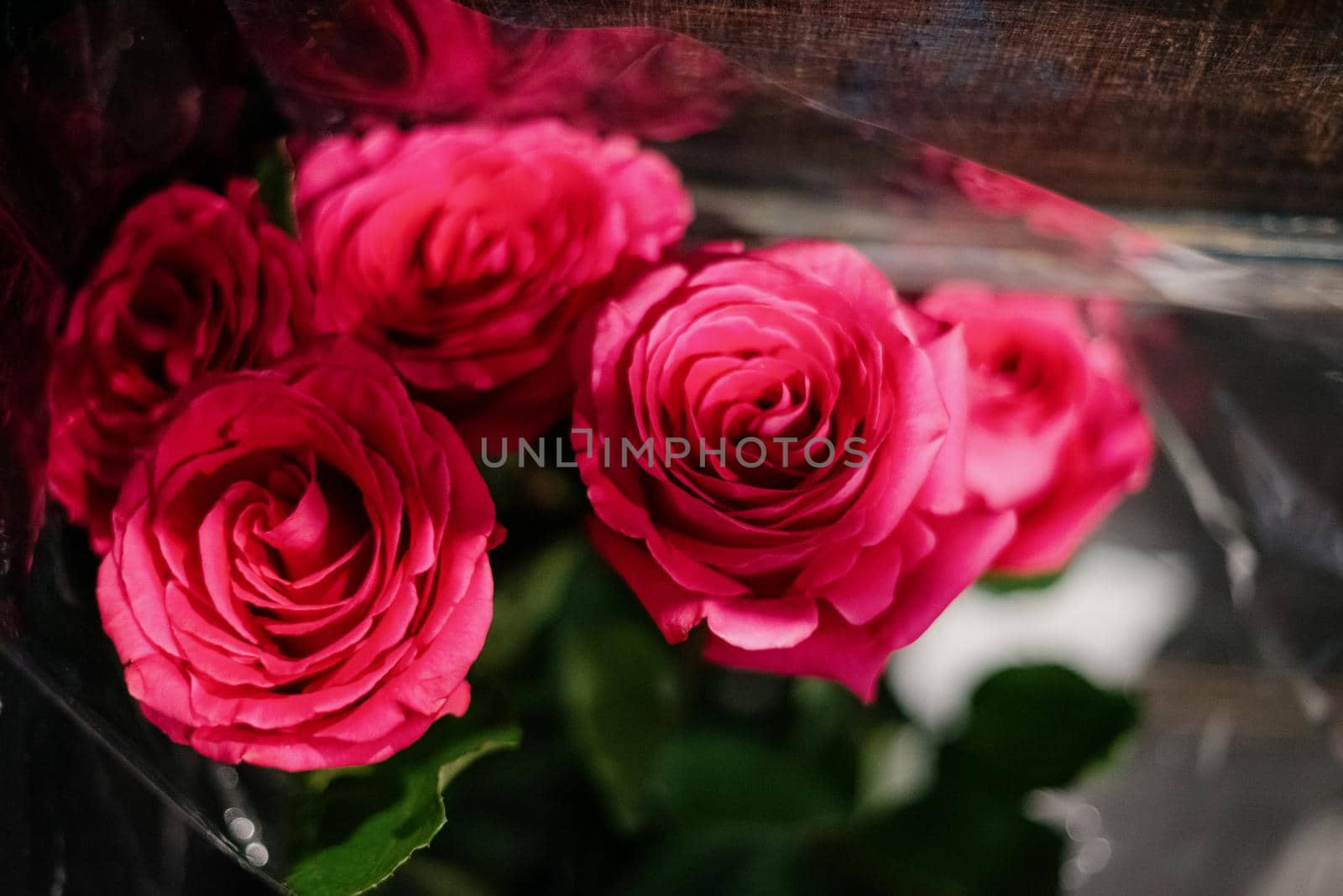 Red roses in a flower shop.Flowers in a flower shop. Concept flower store and delivery. by Kovenkin