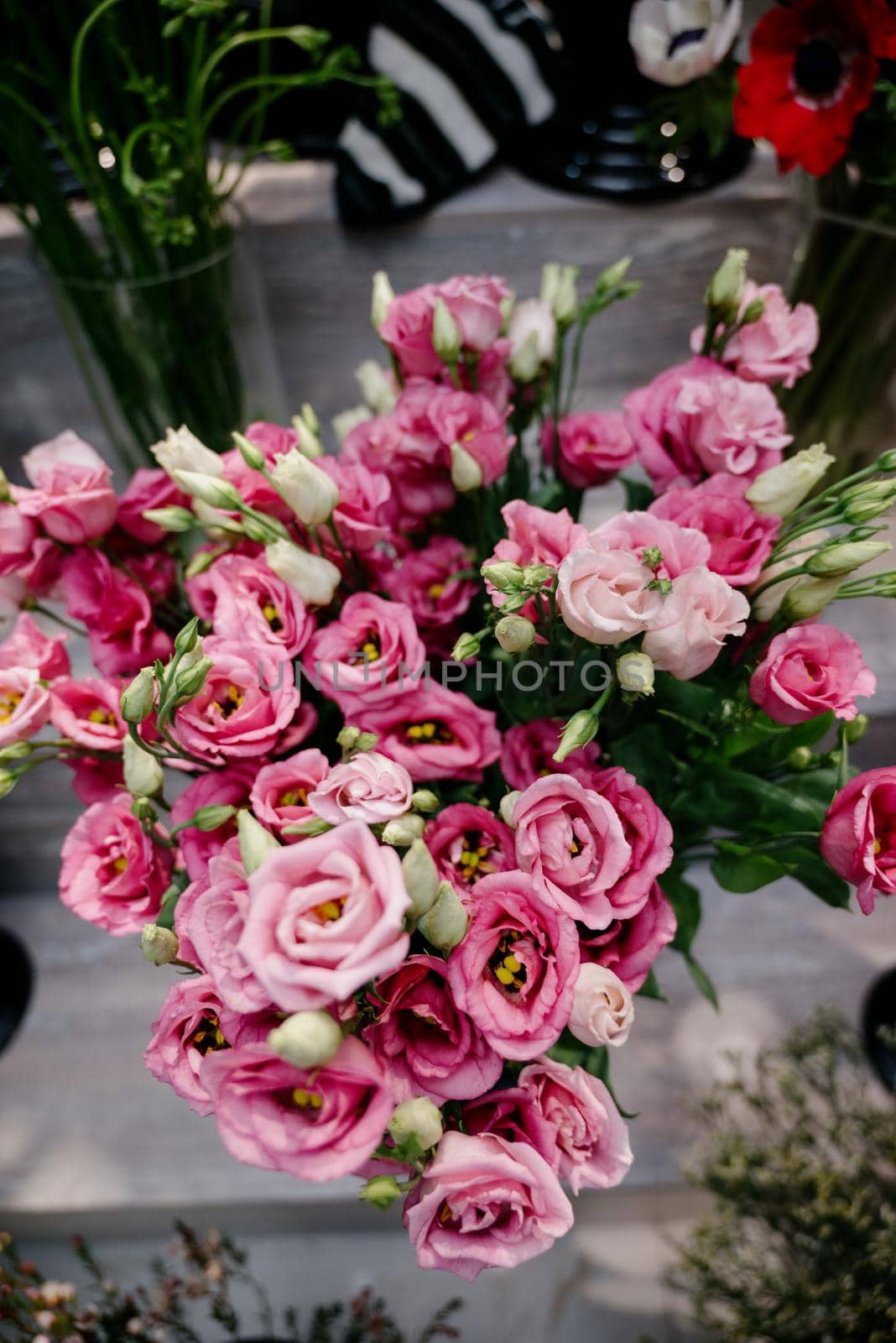 Pink roses in a flower shop.Flowers in a flower shop. Concept flower store and delivery. by Kovenkin