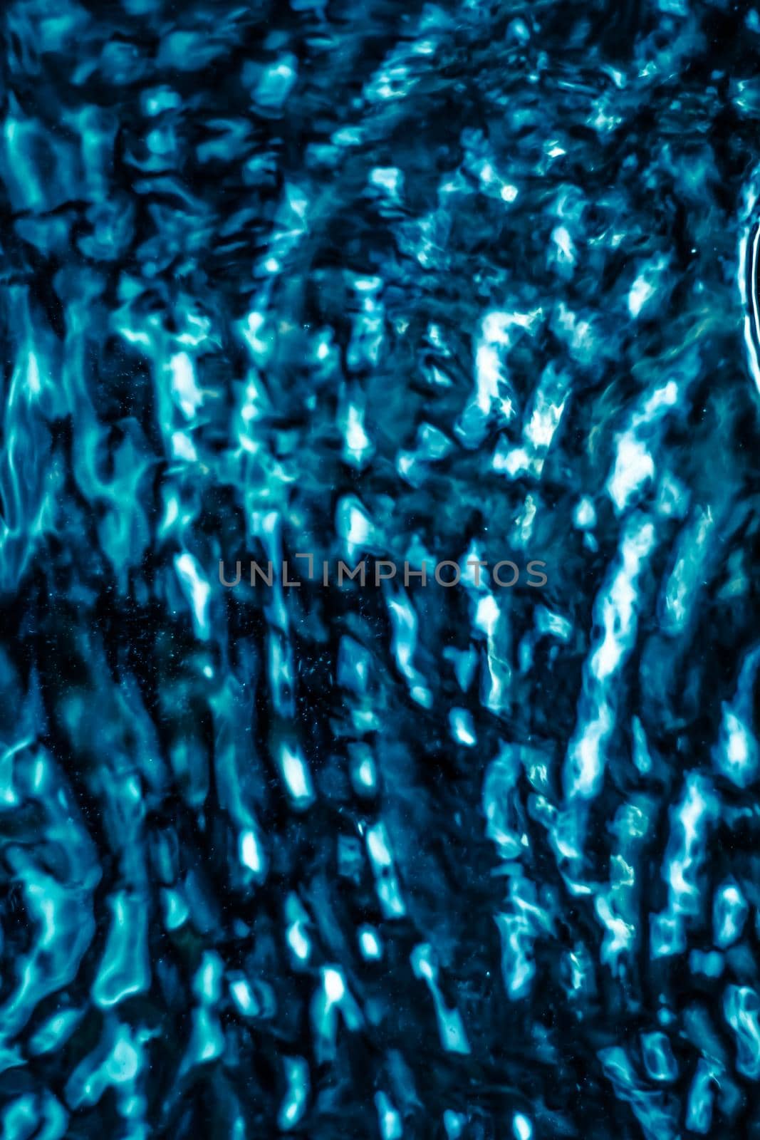 Abstract blue liquid surface as background - futuristic design and science concept. Deep blue waters