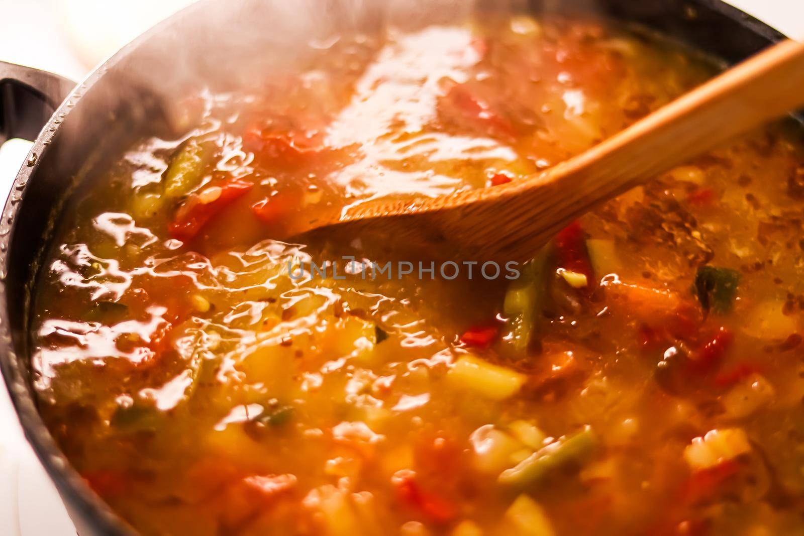 Cooking vegetable soup in saucepan, comfort food and homemade meal concept