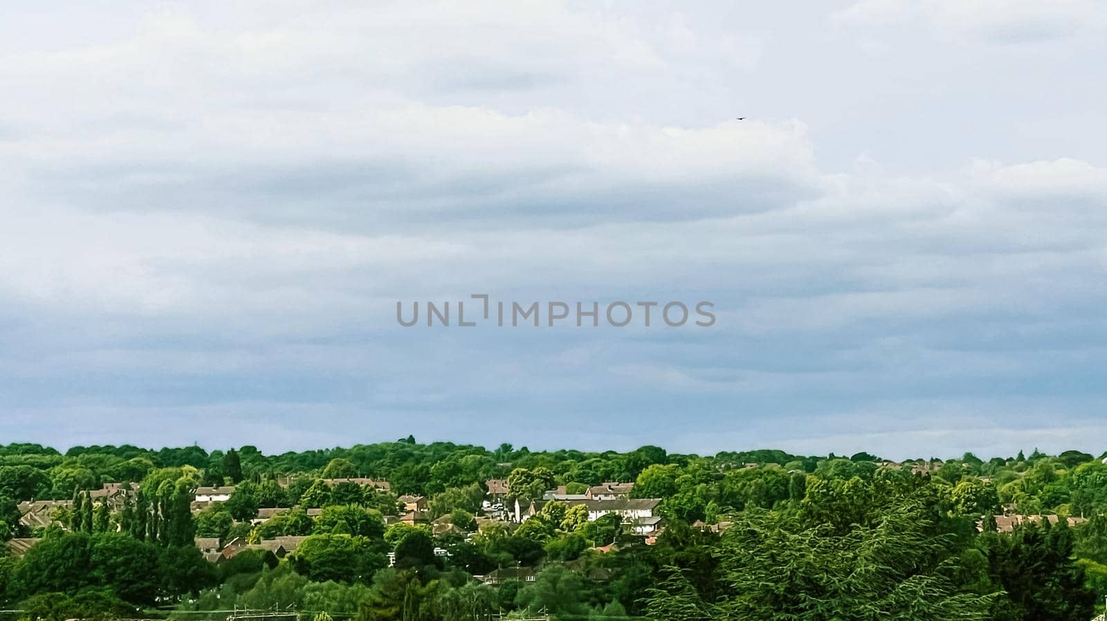 Beautiful English countryside landscape in Hertfordshire, England, United Kingdom, green foliage, villages and cloudy sky, weather and nature concept