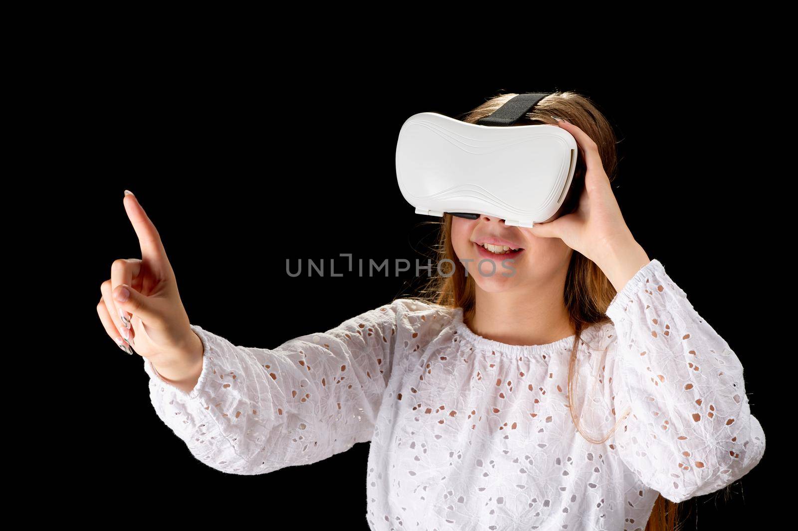 girl, teenager wearing VR glasses and interacting with virtual reality, entertainment technology concept by PhotoTime