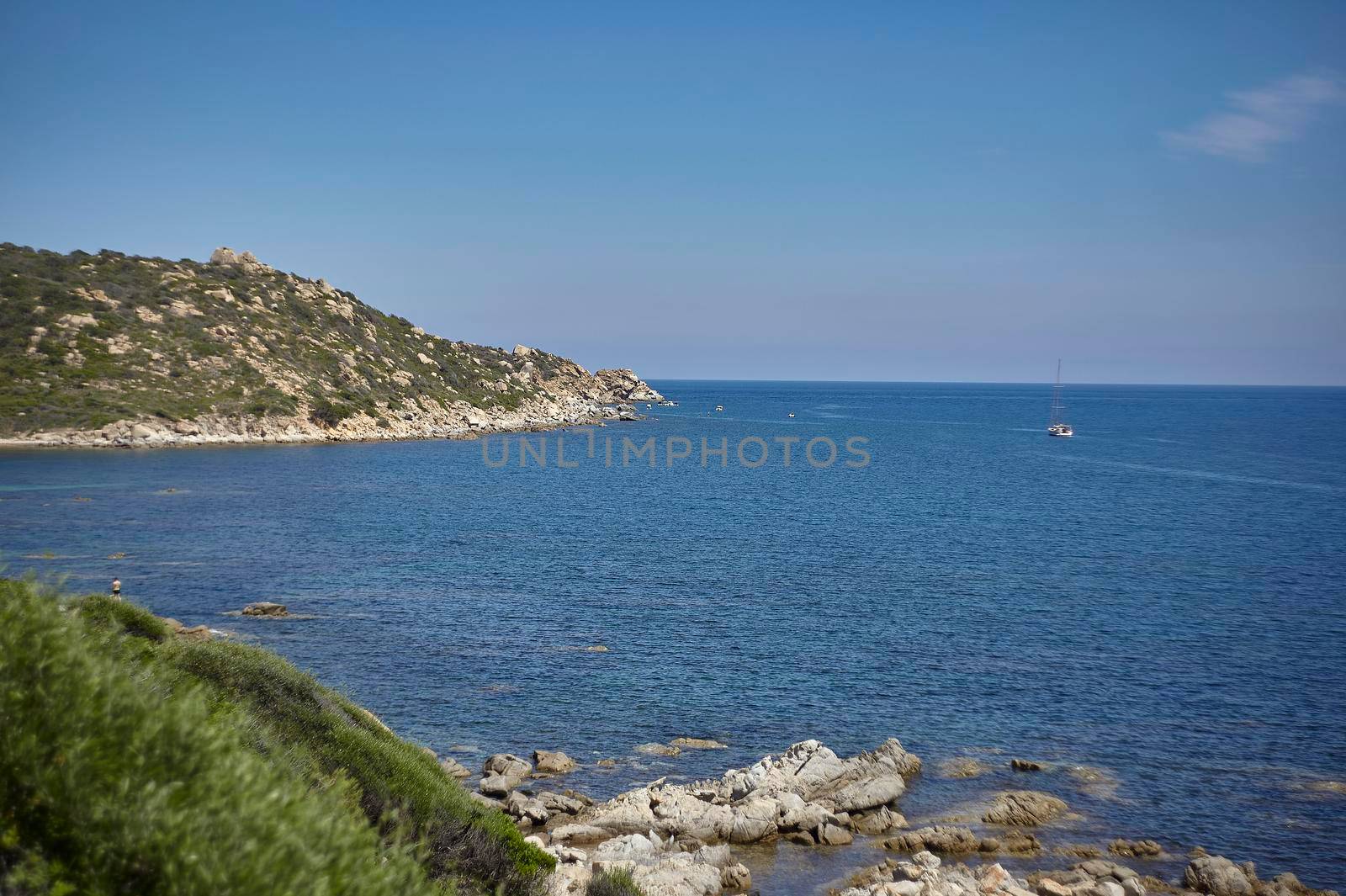View of the Mediterranean sea surrounded by the indented coastline and rich in vegetation of the south of Sardinia.