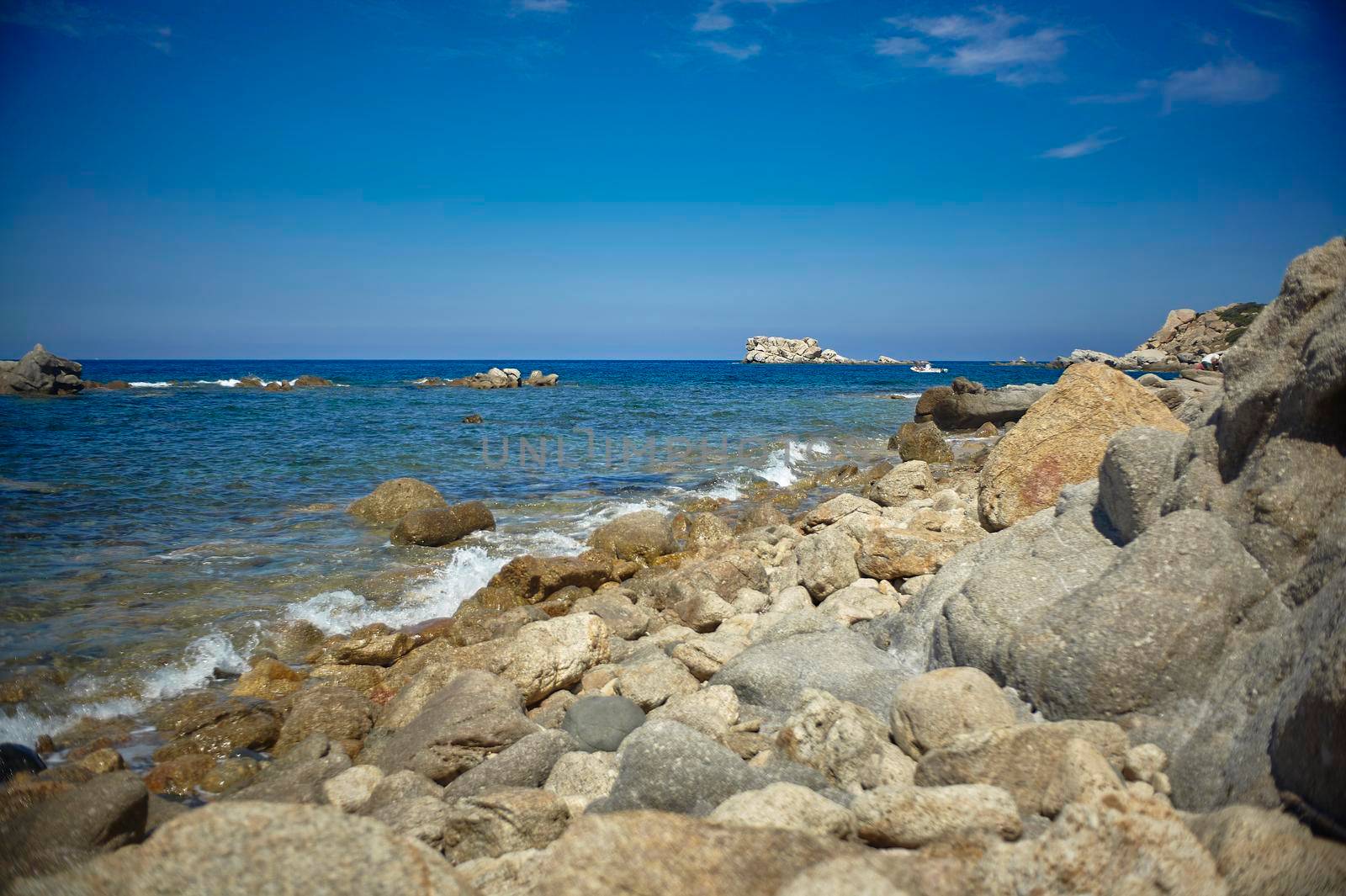 Detail of a cliff full of small and medium-sized stones that lies on the Mediterranean sea of southern Sardinia.