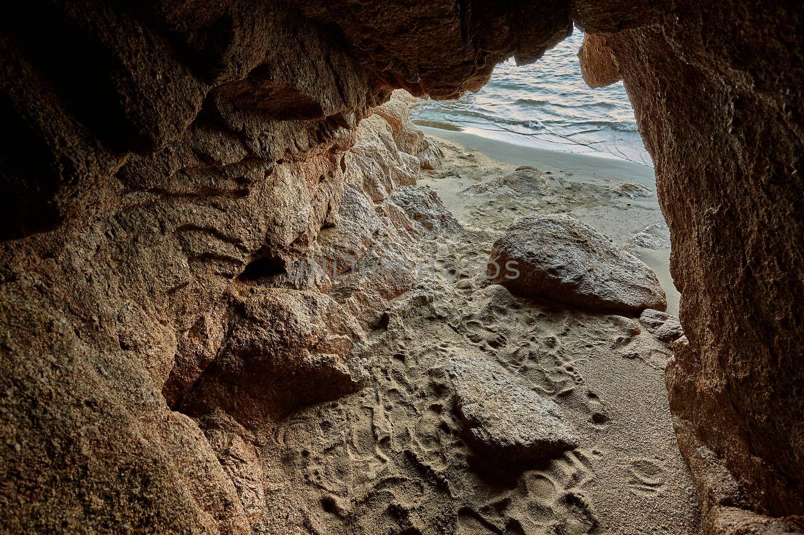 Small sea cave overlooking a Mediterranean beach in hdr.