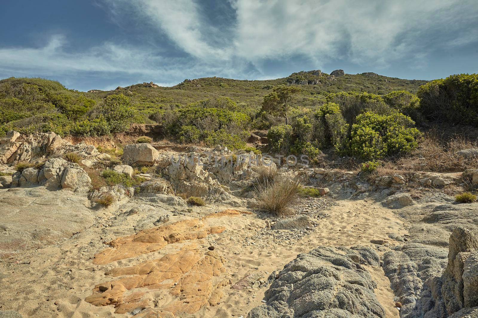 Desert landscape of some hills overlooking the Mediterranean in the south of Sardinia.