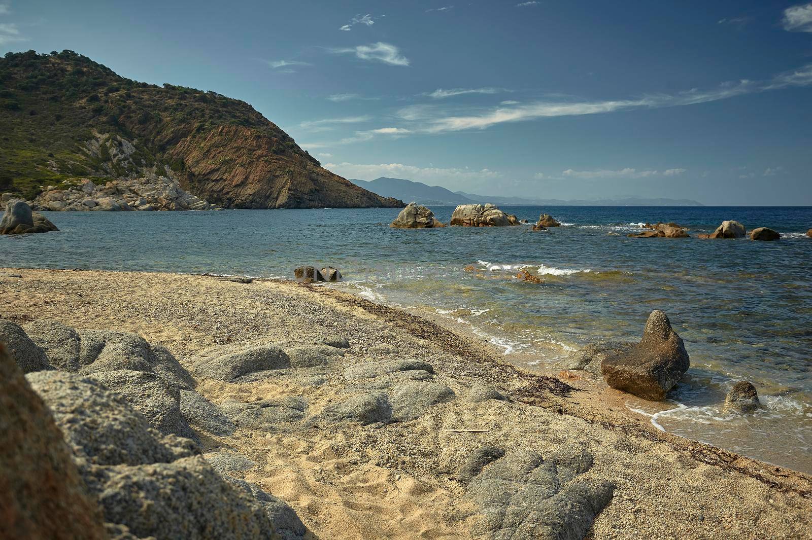 Beautiful Mediterranean beach typical of the coast of southern Sardinia taken over in summer.