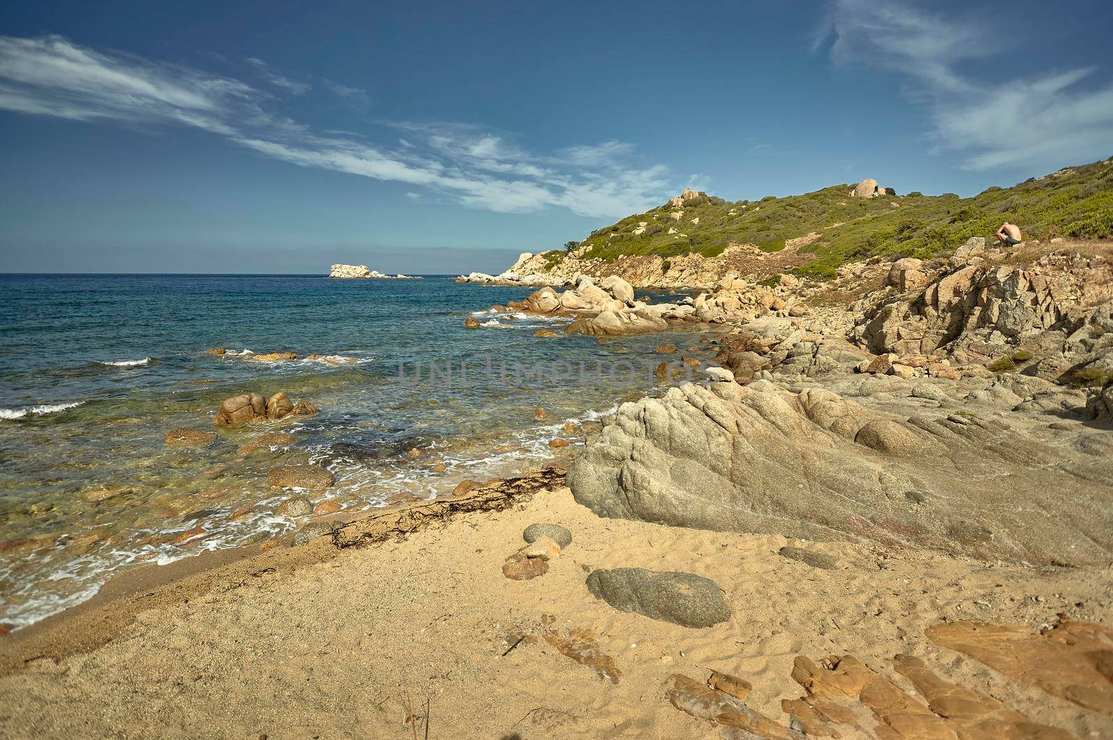 Beautiful Mediterranean beach typical of the coast of southern Sardinia taken over in summer.