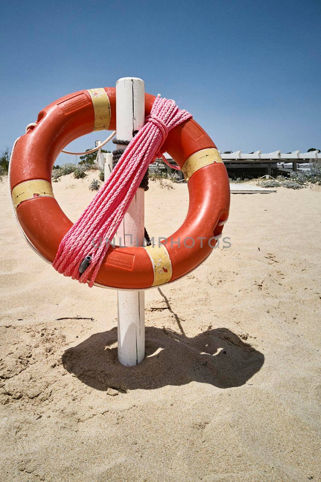 The life buoy hanging on the beach by pippocarlot