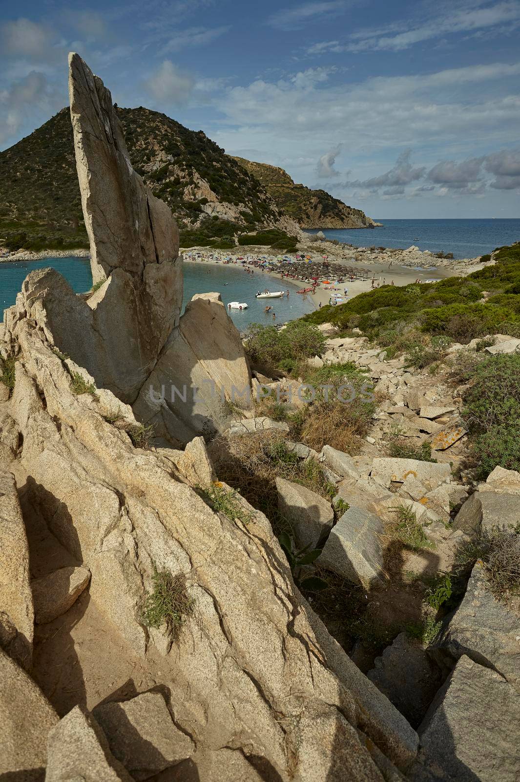 Natural view of the Punta Molentis beach taken from the height of the rocks on the side of the beach. Vertical Shot.