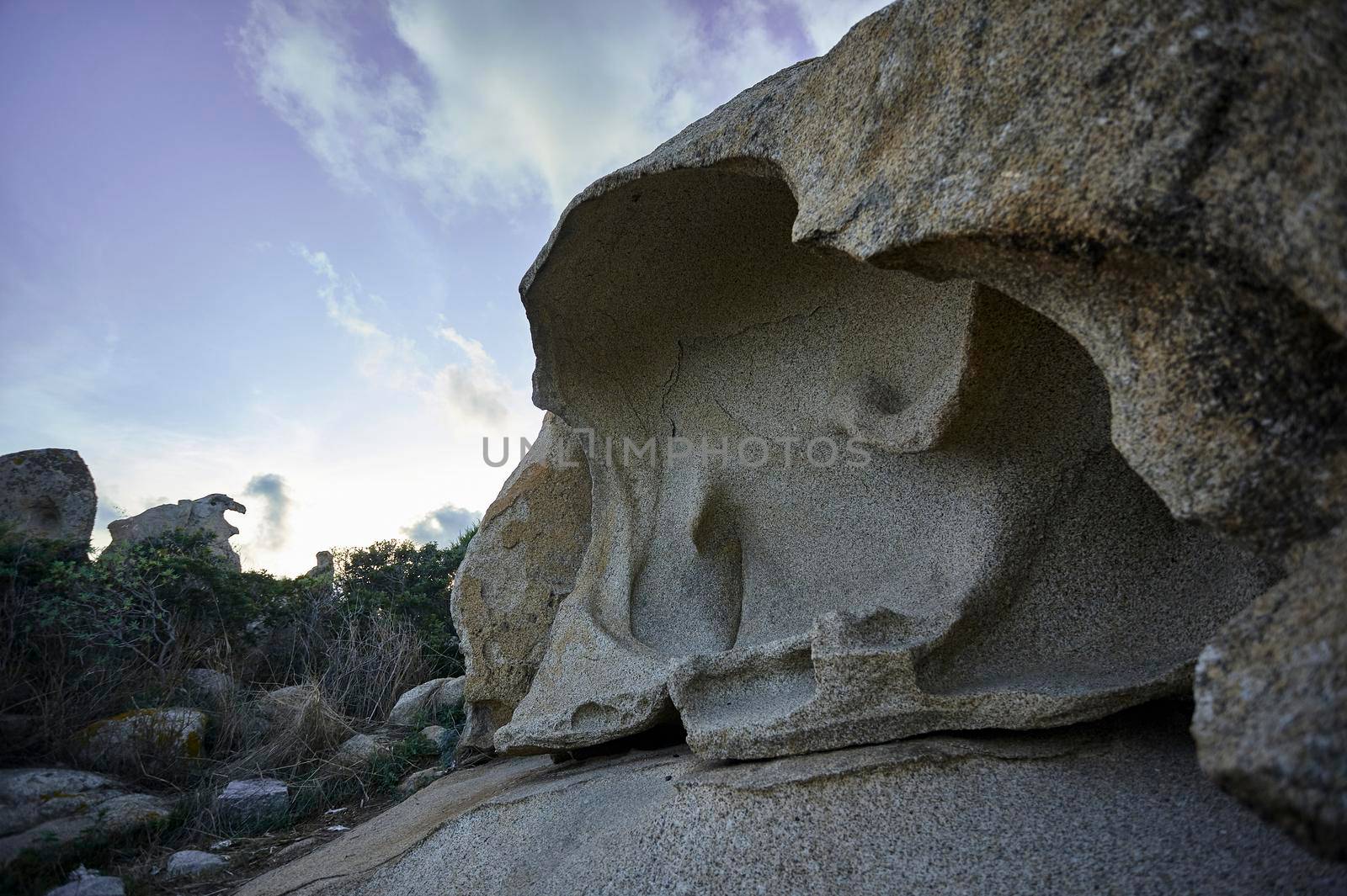 Large granite rock quarried and dug by the elements and the sea that is near. Typical information on the southern coast of the sardgena.