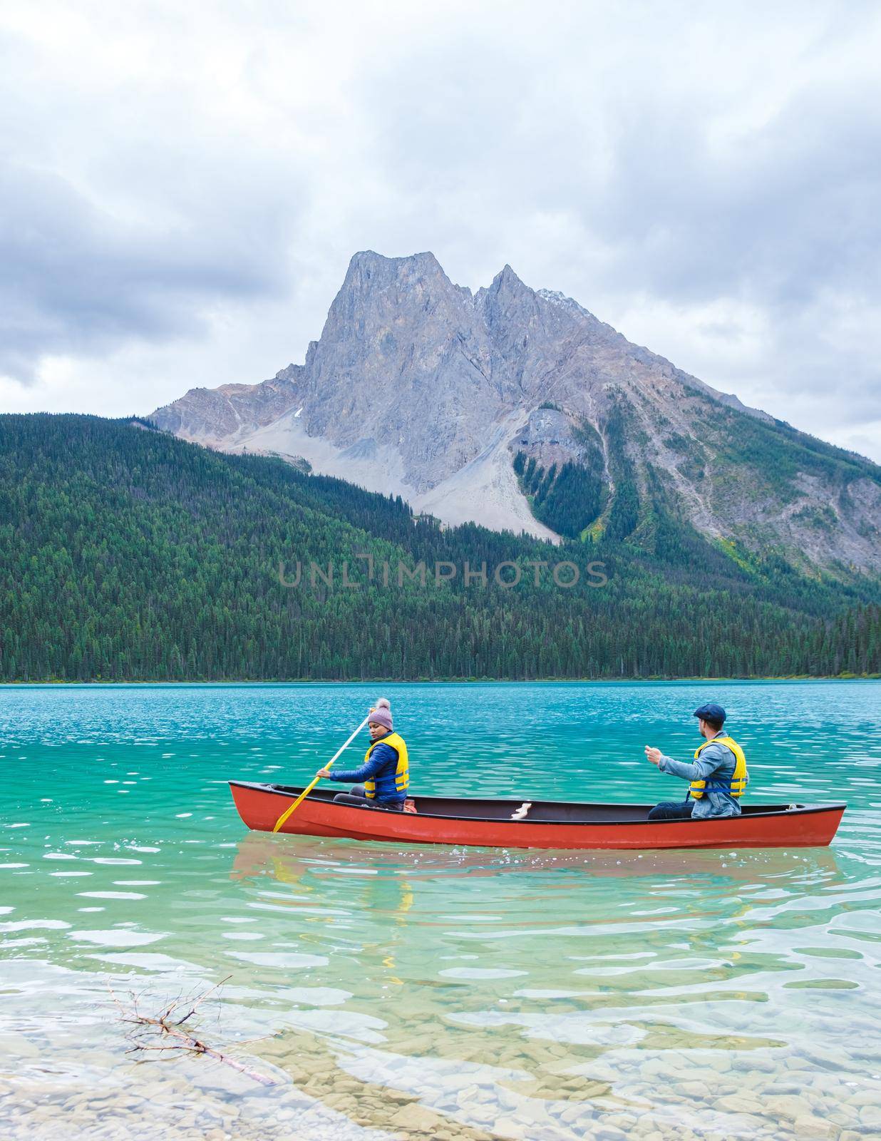 Emerald Lake in Autumn at the Yoho National Park Alberta Canada, men by the Emerald lake Canada by fokkebok