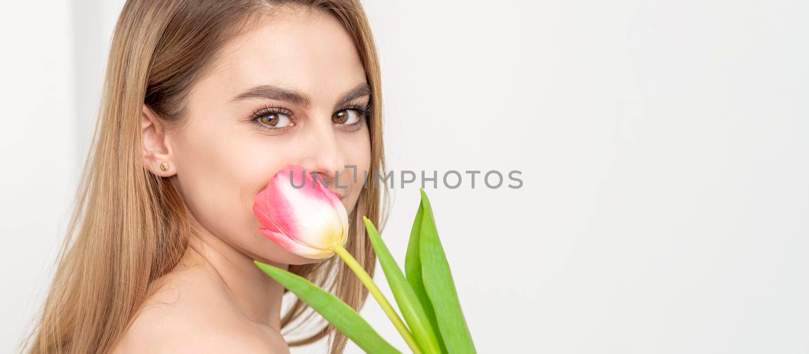 Young woman with one tulip by okskukuruza