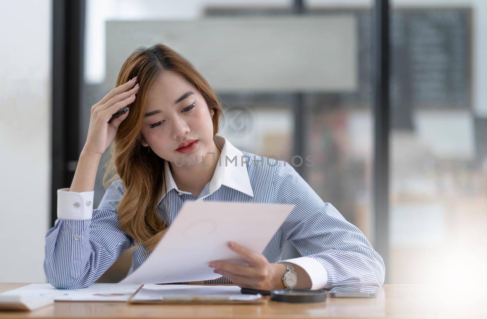 Asian women are bored from their online studies, have a sad face and have been tired from their studies for a long time..