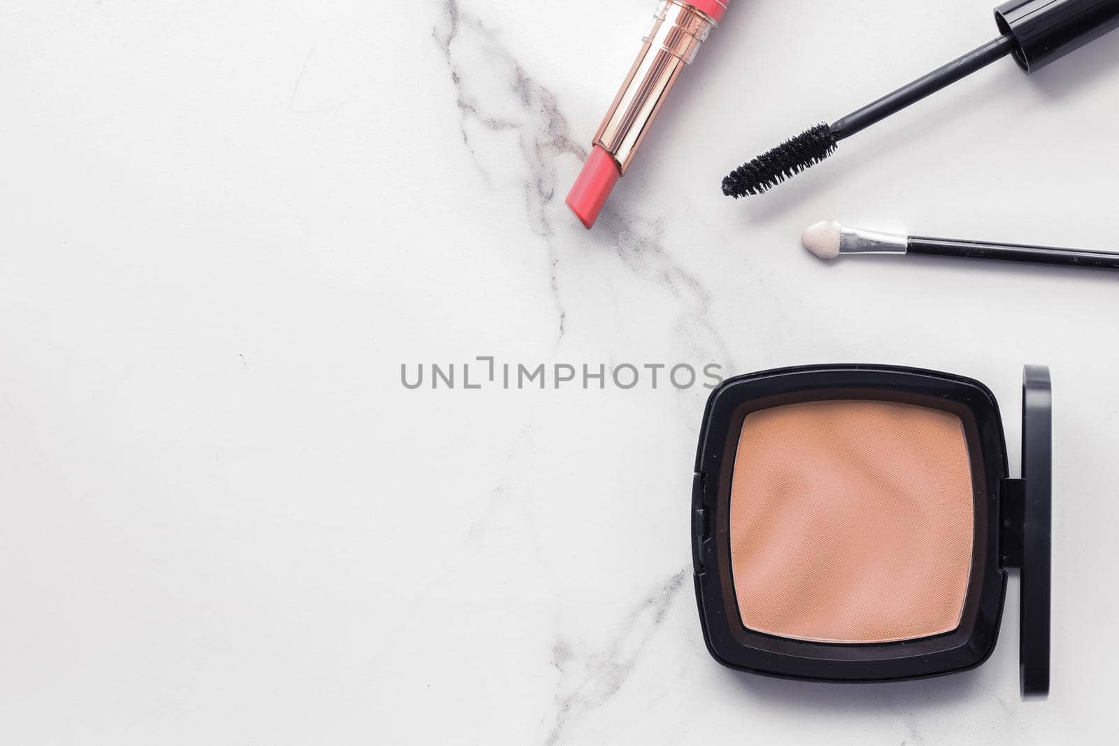 Make-up and cosmetics flatlay on marble by Anneleven