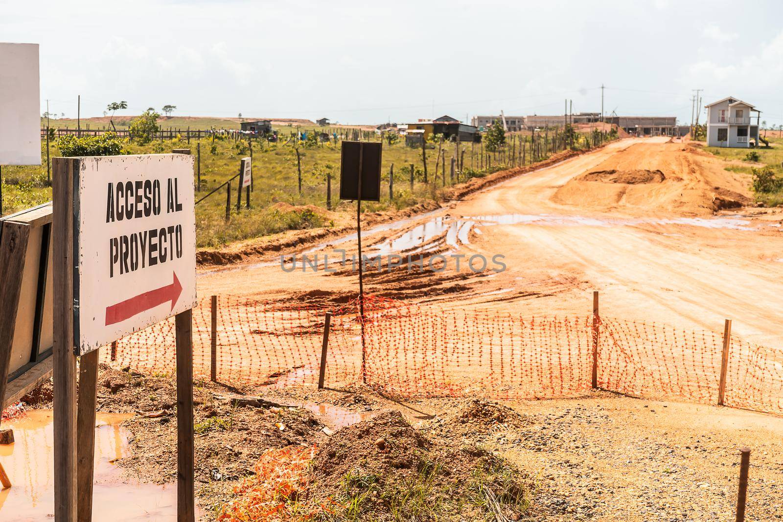 Sign that says in Spanish Access to the Project at the entrance of a construction site in a rural area of Nicaragua