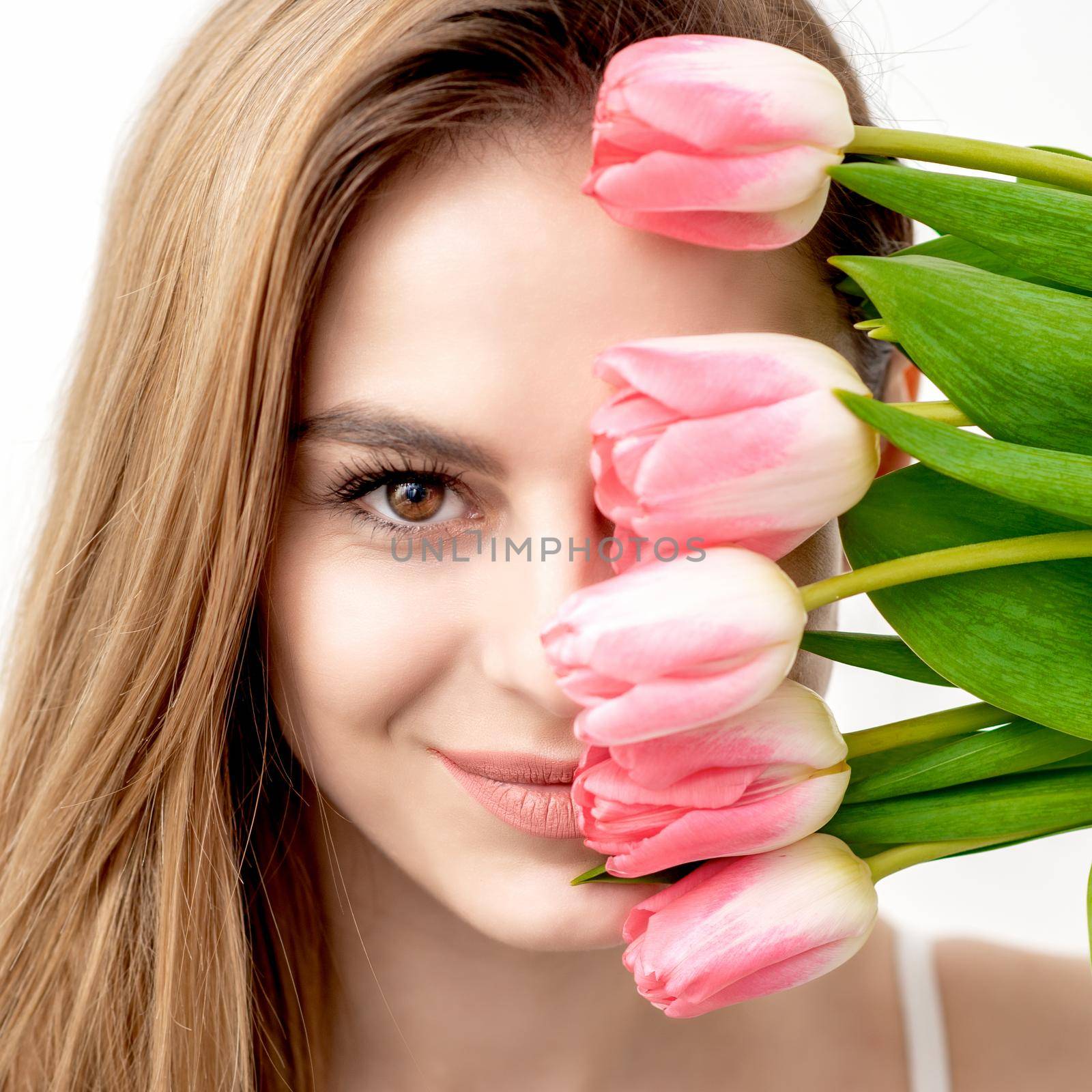 Portrait of woman with pink tulips by okskukuruza