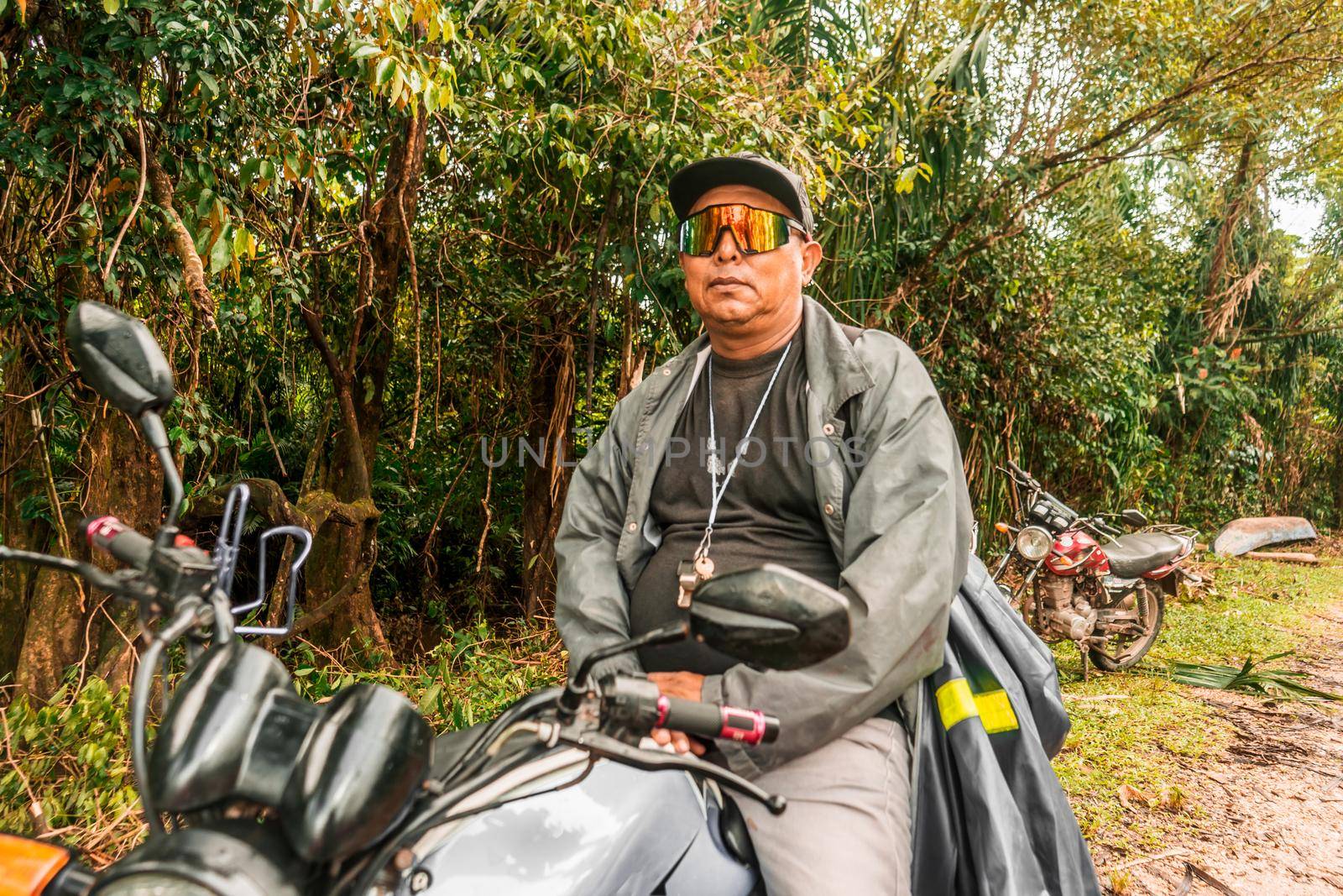 Indigenous man riding a motorbike in a Caribbean community of Nicaragua
