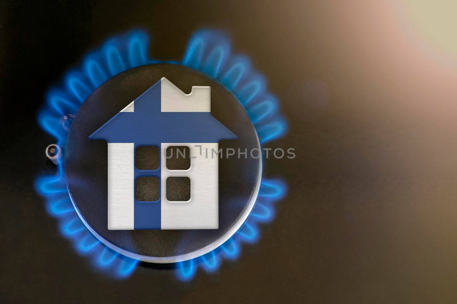 gas crisis. Rising utility costs in Finland. Energy crisis, export-import problems in Finland. The concept, gas burner and house model are colored in the colors of the flag
