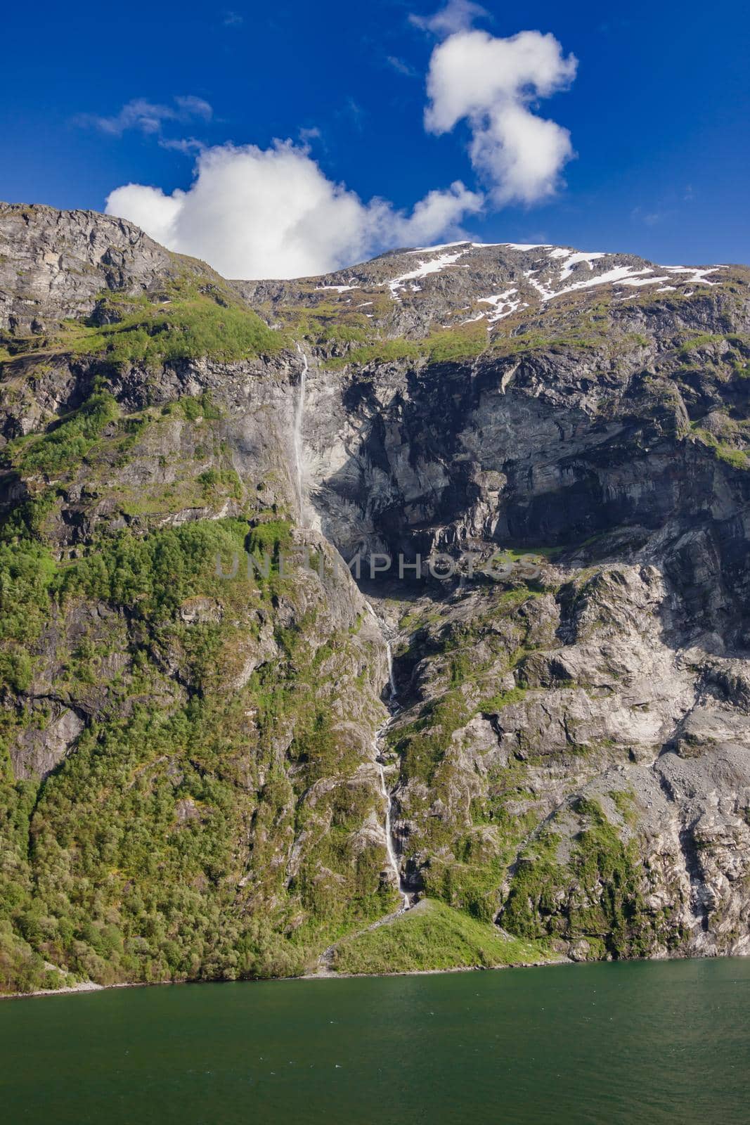 Beautiful and imposing Norwegian fjord in spring with its waterfalls.