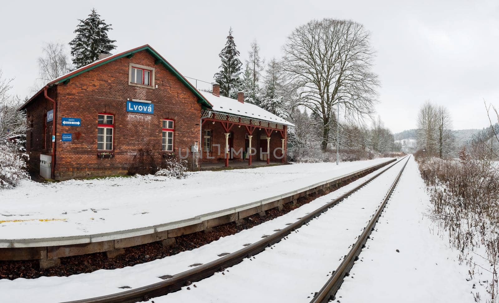 Lvova, Czechia. 10th ov January 2021.  Historic single-track train station covered with fresh snow during January.